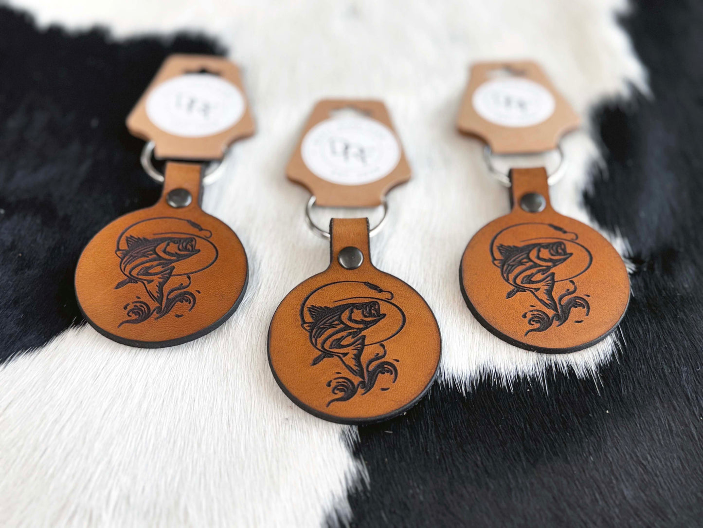 Leather keychains laser engraved with fish on cowhide