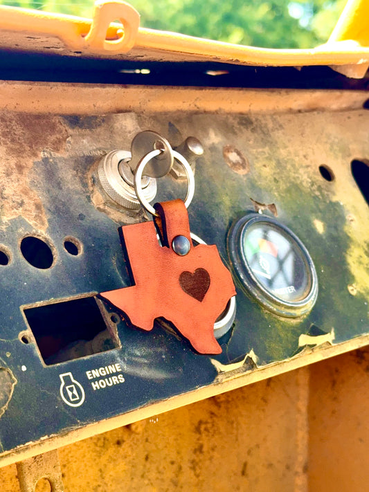 Keychain shaped like the state of Texas with a heart.